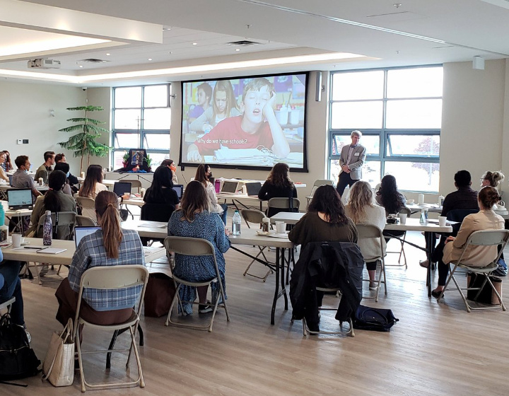 Group of teachers viewing a presentation for a professional development meeting